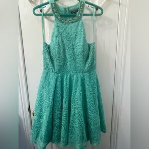 Mint green dress with jewel collar.